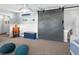 Spacious bonus room with barn door, carpet, and plenty of natural light at 120 Lookout Point Dr, Osprey, FL 34229