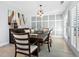 Dining room with wood table and chairs, gray walls at 120 Lookout Point Dr, Osprey, FL 34229