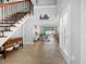Entryway with staircase, view to living room and backyard at 120 Lookout Point Dr, Osprey, FL 34229