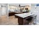 Spacious kitchen with large island and breakfast bar, offering ample counter and cabinet space at 120 Lookout Point Dr, Osprey, FL 34229