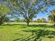 Community park with large trees and grassy areas at 120 Lookout Point Dr, Osprey, FL 34229