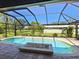 Screened pool and patio area with fire pit at 120 Lookout Point Dr, Osprey, FL 34229
