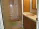 Bathroom with tub, sink, and wooden vanity at 1208 44Th Avenue E Dr, Ellenton, FL 34222