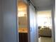Clean bathroom with a sink, mirror, and barn door entry at 1208 44Th Avenue E Dr, Ellenton, FL 34222
