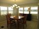 Dining room featuring a chandelier and wood table set at 1208 44Th Avenue E Dr, Ellenton, FL 34222