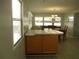 Bright dining area with wood table and chairs at 1208 44Th Avenue E Dr, Ellenton, FL 34222