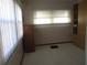 Small office with ample natural light and built-in shelving at 1208 44Th Avenue E Dr, Ellenton, FL 34222