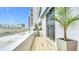 Private balcony with tile flooring and room for plants at 1233 N Gulfstream Ave # 301, Sarasota, FL 34236