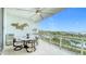 Enjoy water views from this balcony with seating and ceiling fan at 1233 N Gulfstream Ave # 301, Sarasota, FL 34236