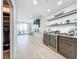 Modern wet bar with beverage fridge and shelving at 1233 N Gulfstream Ave # 301, Sarasota, FL 34236