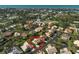 Aerial view highlighting a single-story home in a residential neighborhood near the water at 148 Inlets Blvd # 148, Nokomis, FL 34275