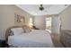 Serene bedroom with a ceiling fan, soft color palette, and access to the Primary bathroom at 148 Inlets Blvd # 148, Nokomis, FL 34275