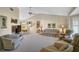 Inviting living room boasts neutral decor, comfortable seating, and seamless flow into the dining area at 148 Inlets Blvd # 148, Nokomis, FL 34275