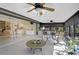 Inviting sunroom with comfortable seating, ceiling fans, and abundant natural light at 148 Inlets Blvd # 148, Nokomis, FL 34275