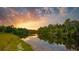 Scenic river view at sunset with kayaker at 14924 Sora Way, Bradenton, FL 34212
