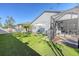 Spacious backyard with artificial turf and screened patio at 14924 Sora Way, Bradenton, FL 34212