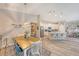 Bright dining area with a farmhouse table and view into the kitchen at 14924 Sora Way, Bradenton, FL 34212