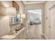 Bright entryway with a console table and mirrors reflecting light at 14924 Sora Way, Bradenton, FL 34212