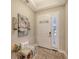 Inviting entryway with decorative wall art and wood bench at 14924 Sora Way, Bradenton, FL 34212