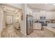 Modern kitchen with white shaker cabinets and stainless steel appliances at 14924 Sora Way, Bradenton, FL 34212