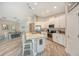 Modern kitchen boasts a large island, stainless steel appliances, and white cabinetry at 14924 Sora Way, Bradenton, FL 34212