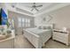 Bright and airy main bedroom with plantation shutters and a large bed at 14924 Sora Way, Bradenton, FL 34212