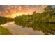 Scenic river view at sunset with a kayak at 14924 Sora Way, Bradenton, FL 34212