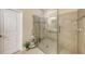 Walk-in shower with glass enclosure and neutral tile at 14924 Sora Way, Bradenton, FL 34212