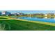Community lake view with homes lining the edge and grassy areas at 15813 6Th E Ave, Bradenton, FL 34212