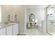 Bathroom with double vanity, granite countertop and a walk in shower at 15813 6Th E Ave, Bradenton, FL 34212