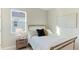 Bright bedroom with a double bed, nightstand, and window at 15813 6Th E Ave, Bradenton, FL 34212
