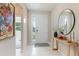 Bright and airy entryway with a large mirror and console table at 15813 6Th E Ave, Bradenton, FL 34212