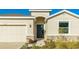 Home's entrance, showcasing a black door and stone accents at 15813 6Th E Ave, Bradenton, FL 34212