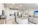 Modern kitchen with white cabinets, granite counters and island at 15813 6Th E Ave, Bradenton, FL 34212
