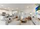 Open concept living room with large sectional and water view at 15813 6Th E Ave, Bradenton, FL 34212