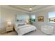 Main bedroom with a ceiling fan, large windows, and plenty of natural light at 15813 6Th E Ave, Bradenton, FL 34212