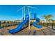 Fun playground with blue slides and climbing structures at 15813 6Th E Ave, Bradenton, FL 34212