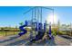 playground with blue slides and climbing features at 15813 6Th E Ave, Bradenton, FL 34212