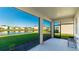 Screened-in porch overlooking a serene lake at 15813 6Th E Ave, Bradenton, FL 34212