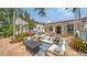 Inviting backyard with outdoor seating, landscaping, and a fire pit at 1682 Hawthorne St, Sarasota, FL 34239