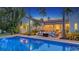 Beautiful backyard pool with a view of the home and patio area, perfect for relaxing and entertaining at 1682 Hawthorne St, Sarasota, FL 34239