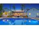 Stunning backyard pool reflecting the home's exterior and lush landscaping, creating a serene outdoor oasis at 1682 Hawthorne St, Sarasota, FL 34239