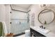 Bathroom featuring a glass-enclosed shower with detailed tilework, modern vanity, and sleek finishes at 1682 Hawthorne St, Sarasota, FL 34239