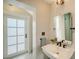 Well-lit bathroom with a vessel sink, tile floor, and access to another area at 1682 Hawthorne St, Sarasota, FL 34239