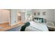 Cozy bedroom with natural light, wood flooring, and an attached bathroom at 1682 Hawthorne St, Sarasota, FL 34239