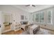 Bright bedroom featuring lots of natural light, a bed with stylish decor, and hardwood floors at 1682 Hawthorne St, Sarasota, FL 34239