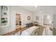 Bright bedroom featuring a bed with stylish decor, and an ensuite bathroom with a shower at 1682 Hawthorne St, Sarasota, FL 34239