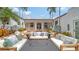 Charming courtyard featuring an outdoor seating area, beautiful landscaping, and fountains creating a serene and inviting ambiance at 1682 Hawthorne St, Sarasota, FL 34239