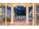 Covered outdoor patio showing dining table, seating, and views of the lush backyard at 1682 Hawthorne St, Sarasota, FL 34239