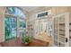 Bright dining area with a wooden table, large windows, and an open floor plan showcasing natural light at 1682 Hawthorne St, Sarasota, FL 34239